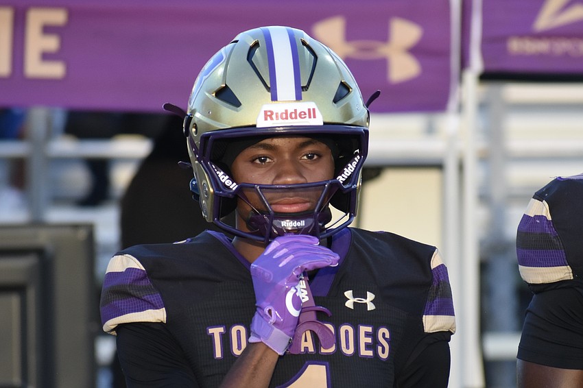 Senior Dylan Wester adjusts his helmet.