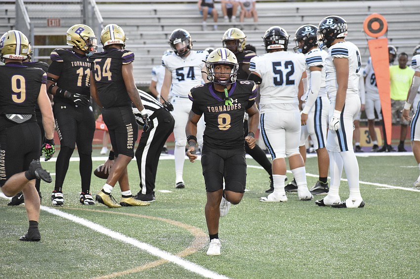 Senior Greyson Kelly-Hancz runs across the field.