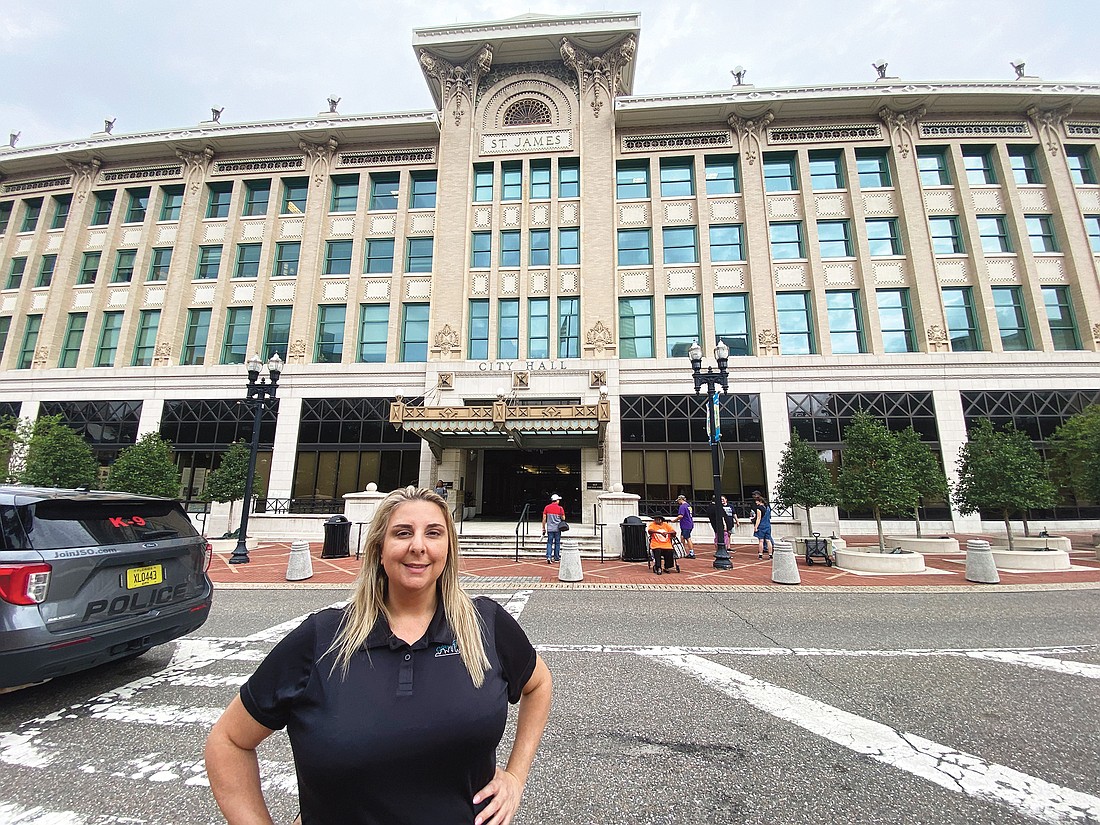 Jax Tours founder Tina Sauvage stands in front of City Hall in Downtown Jacksonville.