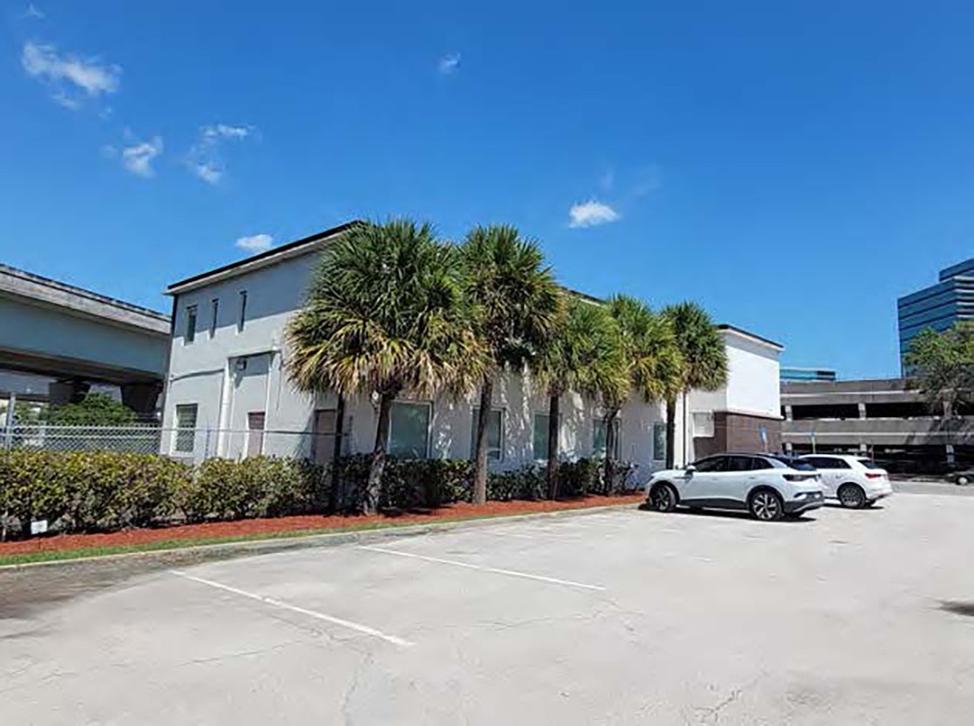 A Colliers marketing brochure shows the building sold by the Jacksonville Transportation Authority at 1022 Prudential Drive.