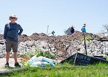 Eddie Abrams stands at the base of his raised lot on Longboat Drive North where he is building his insulating concrete form house. Abrams and his son are both rebuilding on raised lots after Hurricane Helene caused severe flooding on Longboat Key.