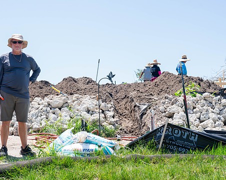 Eddie Abrams stands at the base of his raised lot on Longboat Drive North where he is building his insulating concrete form house. Abrams and his son are both rebuilding on raised lots after Hurricane Helene caused severe flooding on Longboat Key.