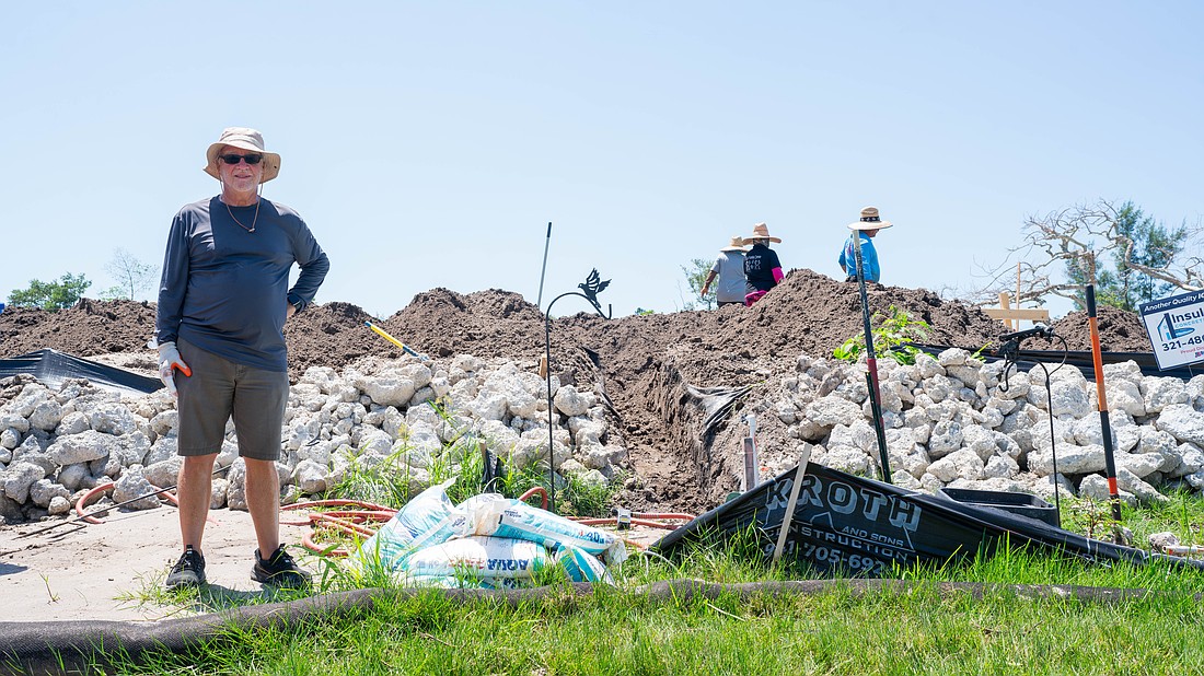 Eddie Abrams stands at the base of his raised lot on Longboat Drive North where he is building his insulating concrete form house. Abrams and his son are both rebuilding on raised lots after Hurricane Helene caused severe flooding on Longboat Key.