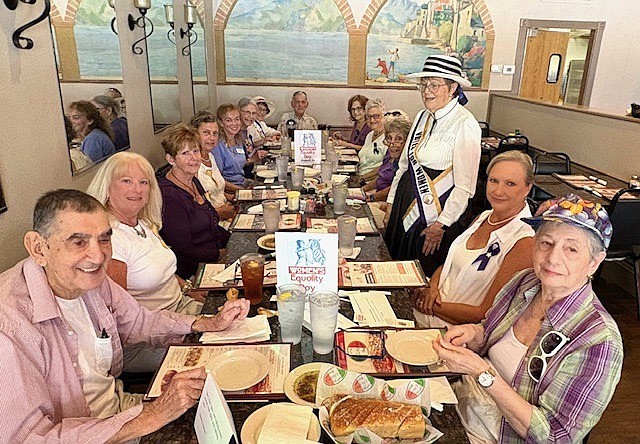 The Flagler County Branch of the American Association of University Women celebrated Women's Equality Day on Aug. 26 at Mezzaluna Pizzeria. Chapter President Gail Palmer stands to speak. Courtesy photo