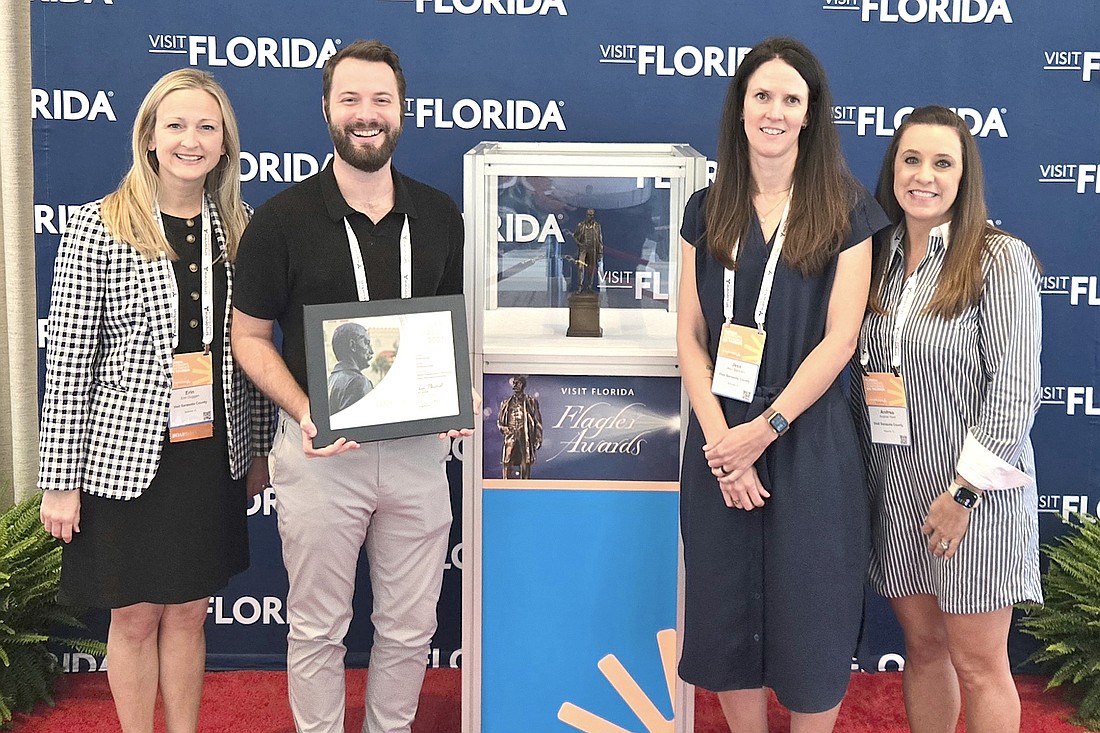 VSC President and CEO Erin Duggan, Director of Community Relationship and Partnership Hunter Carpenter, Marketing Manager Jess Bertolini, and Vice President of Finance and Administration Andrea Hunt with the Silver Flagler Award.