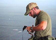 Sarasota Police Department Officer Kyle Carter makes preparations for an explosives training hosted by Bird Key Yacht Club at its soon-to-be-demolished clubhouse on Sept. 5.