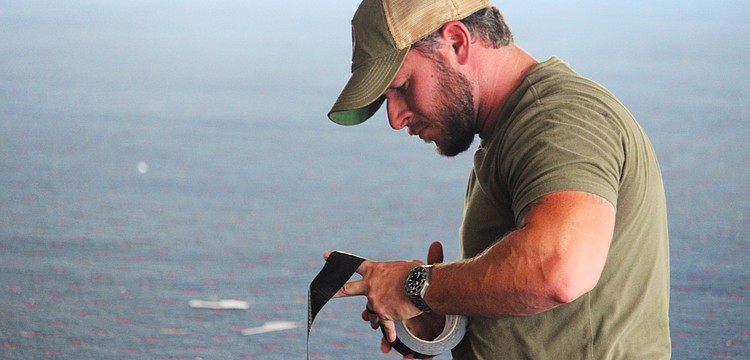 Sarasota Police Department Officer Kyle Carter makes preparations for an explosives training hosted by Bird Key Yacht Club at its soon-to-be-demolished clubhouse on Sept. 5.