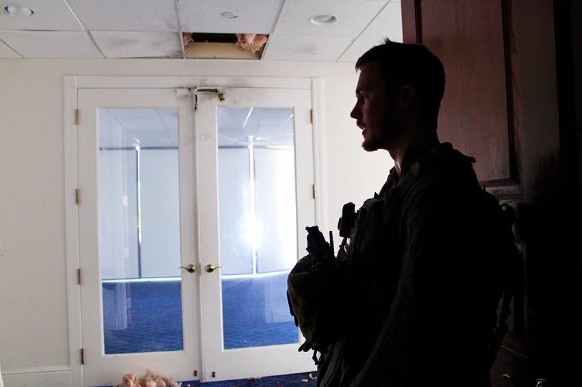 Sarasota Police Department Sgt. Aaron Stoll gives a post-detonation rundown of how first responders train for explosive entries. Bird Key Yacht Club invited officers to use its outgoing clubhouse to hone their techniques.