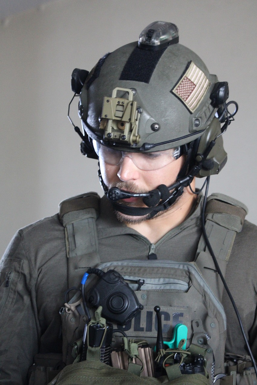 Sarasota Police Department Sgt. Aaron Stoll gives a safety briefing to viewers before officers detonate a charge at Bird Key Yacht Club for a training session.