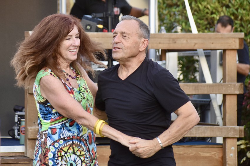 Lakewood Ranch's Doug Thayer spins University Place's Nan McArthy.