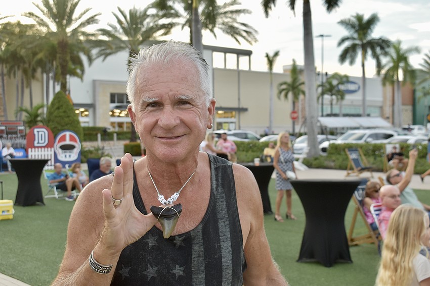 UTC Live at the Green is just one event the Sarasota Over 50 Meet-up Group attends. Sarasota's Steven Najemian shows off a shark tooth necklace he made at another meet-up.