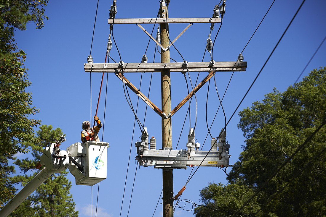 Lineman, Bobby Morrison (113195), works on intelliruptor. distribution lines; employee; hot stick; grid modernization