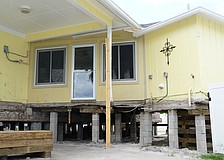 The 1,475 square foot Udermann house has been partially raised using about 50 hydraulic jacks in The Village in Longboat Key. It currently sits 4 and a half feet up and will eventually be raised to 12 feet.