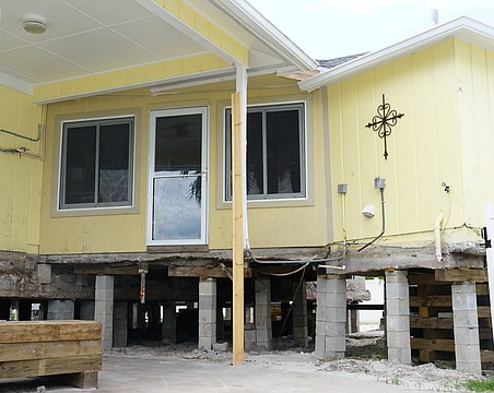 The 1,475 square foot Udermann house has been partially raised using about 50 hydraulic jacks in The Village in Longboat Key. It currently sits 4 and a half feet up and will eventually be raised to 12 feet.