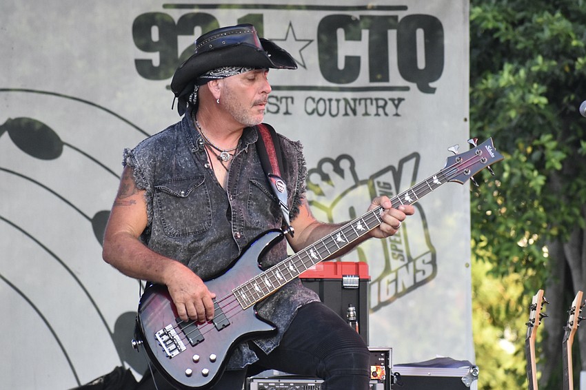 Joey Fingers of Gas House Gorillas performs on stage.