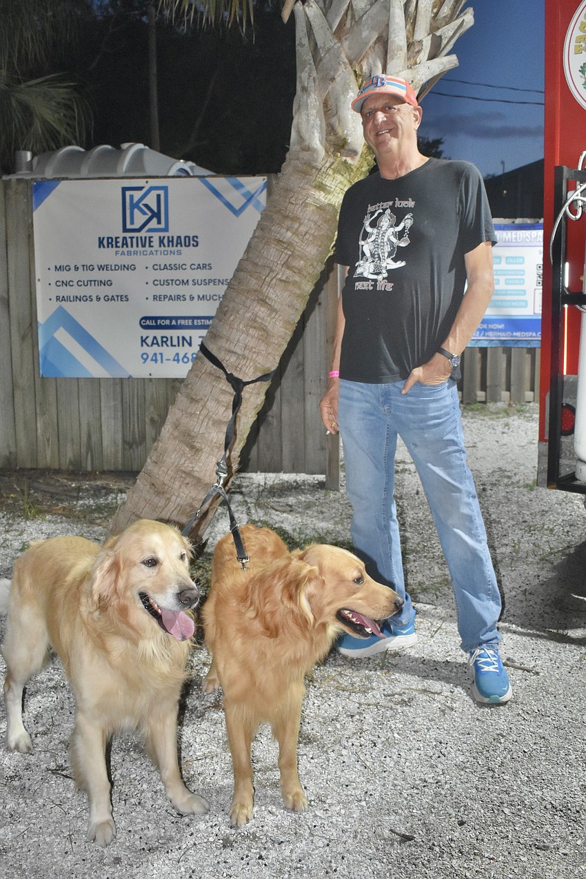 Gary Weiner enjoys the experience with his golden retrievers Zane and Zion.