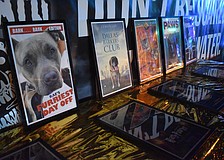 Movie posters in honor of the winning pups are set out on display.