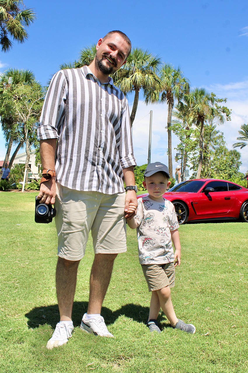 Car show attendees Oleksii and Deniel Kovalsyi liked the variety of vehicles on display at Exotic Cars on the Circle on Sept. 6 at St. Armands Circle.