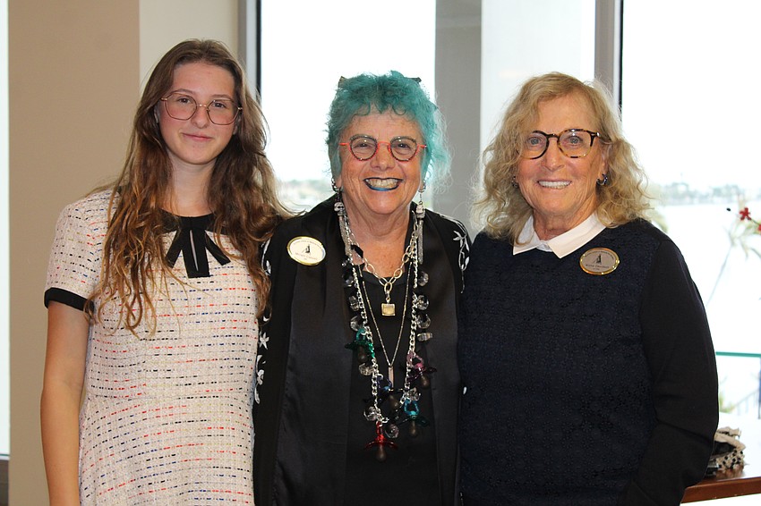 Prospective youth member Dina Altshul chats with artist Miriam Cassell and Wilma Davidson, president of the local branch of the National League of American Pen Women, Inc., at an art exhibition opening on Sept. 9 at Plymouth Harbor.