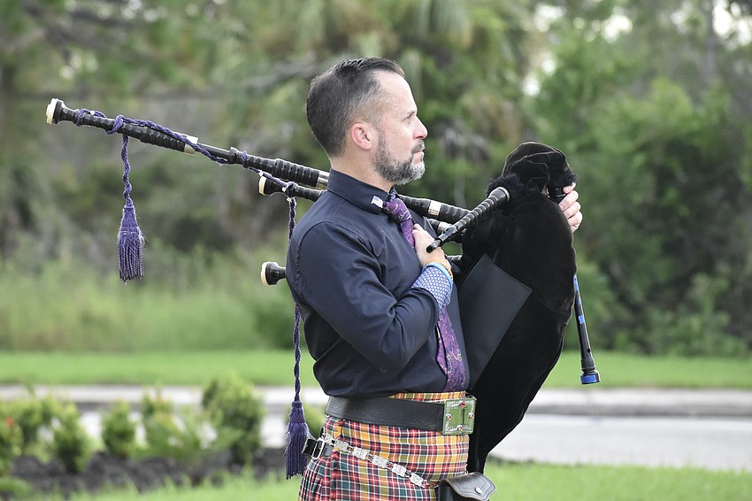 USF Alumnus Ross Allen watches as the flag is raised.