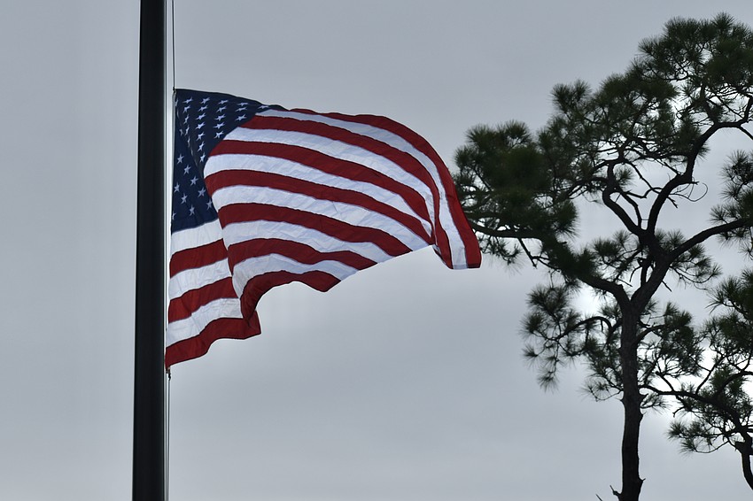 The flag flies after it is raised.
