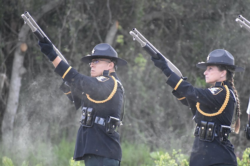 Members of the Sarasota County Sheriff’s Office perform the 21-gun salute.