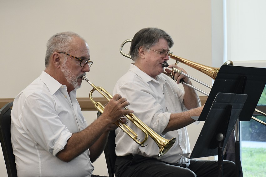 Tim Eaton and James Damoulakis of Braden River Brass perform during the ceremony.