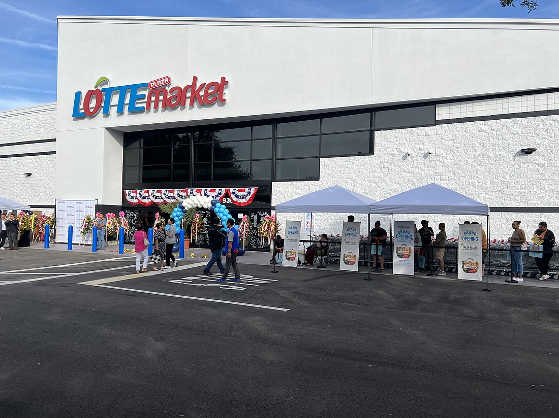 Customers arrived early Sept. 12 for the grand opening of Lotte Plaza Market at 9355 Atlantic Blvd. near Regency.