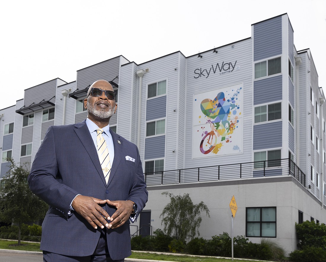 Kenneth T. Welch, St. Petersburg's mayor and a strong advocate for affordable housing in the city, stands outside the Sky Way Loft apartments at 34th Street South.