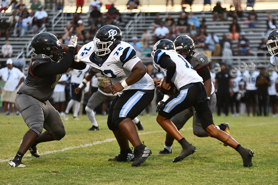 Dr. Phillips' quarterback Camren West rushed against Ocoee during their game on Sept. 12.