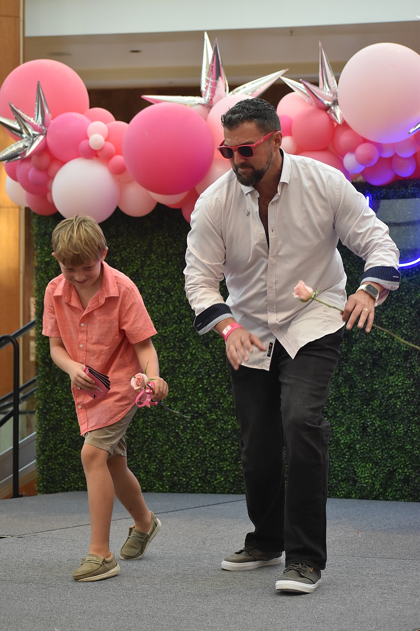 Rick Perkowski joins his father David Perkowski of Preferred SHORE Real Estate to support Men Wear Pink.