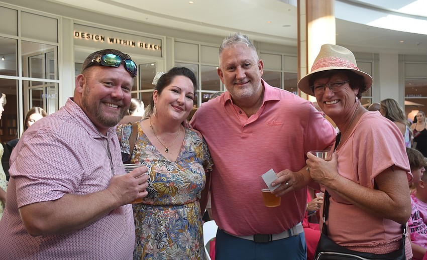 Men Who Wear Pink attendees Jason Francey, Samantha Slechta, Kevin Thompson and Rendy Francey wait for the fashion show to begin.