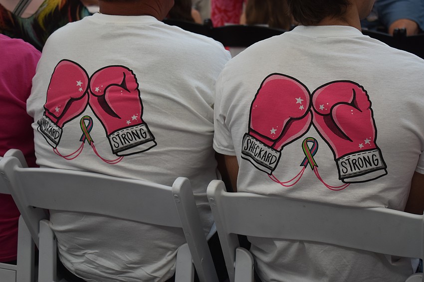 Doug Whitman and Joey Saviano wear shirts in honor of Alicia Shekerd, who died in June after a 17 month battle with stage four metastatic breast cancer.