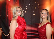 Event Chair Cassandra Hafner and Manatee County Medical Society President Kinga Porter set the tone for the gala with dramatic red dresses.