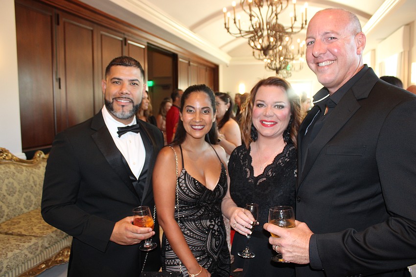 Isven Chavez, Karen Chavez, Leigh Tesar, and Michael Tesar look forward to the night's activities at the Grove Ballroom Sept. 13.
