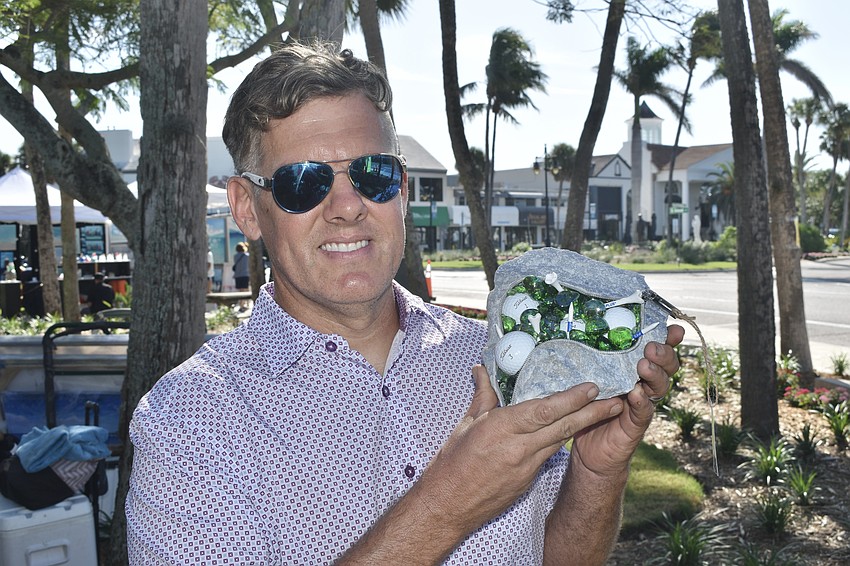 Timothy Gregory holds one of his 