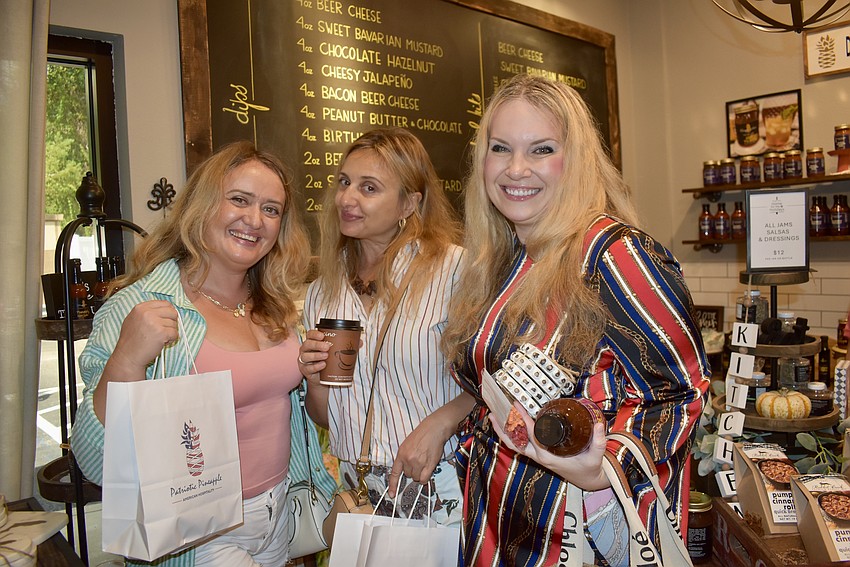Sarasota's Maria Oxyuk, and Wellen Park's Halyna Stavynoha and Yuliya White attend the Harvest Open House Sept. 13.