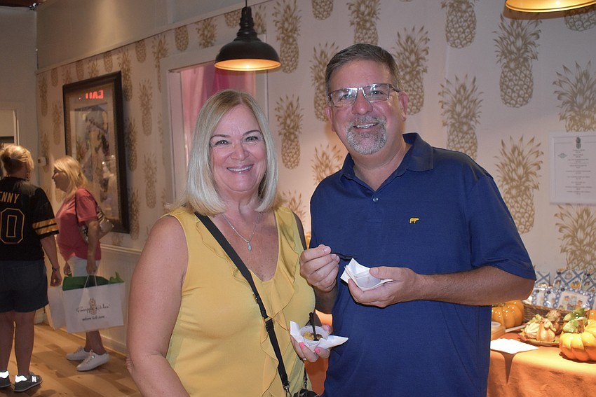 Bradenton's Candy Mercer and Mike Arnold try the apple fritters.