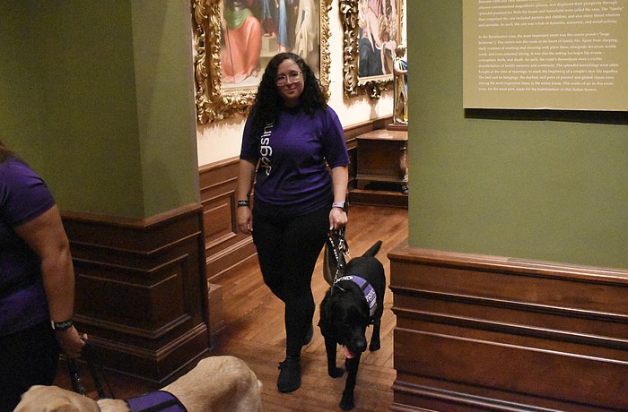 Gillian Daniels walks through the gallery with Stanley.