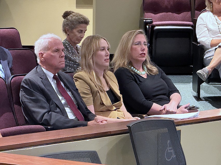From left, attorney Dan Bailey, Selby Gardens COO and General Counsel Chrystal Bailey and President and CEO Jennifer Rominiecki listen as Laurel Park resident Kelly Franklin states her case to the City Commission.