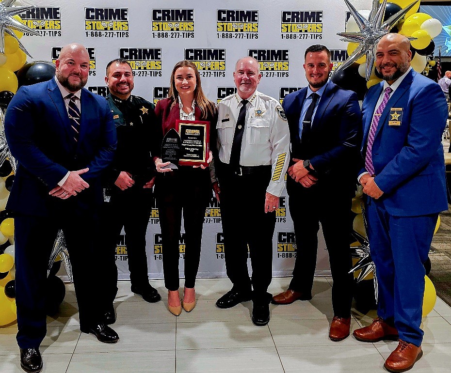 Det. Sgt. George Hristakopoulos, Chief Deputy Joe Barile, Master Det. Kathryn Gordon, Sheriff Rick Staly, Cmdr. Brian Finn and Chief Agustin Rodriguez. Gordon was named 2025 Officer of the Year at the Sept. 4 Crime Stoppers banquet in Daytona Beach. Courtesy photo