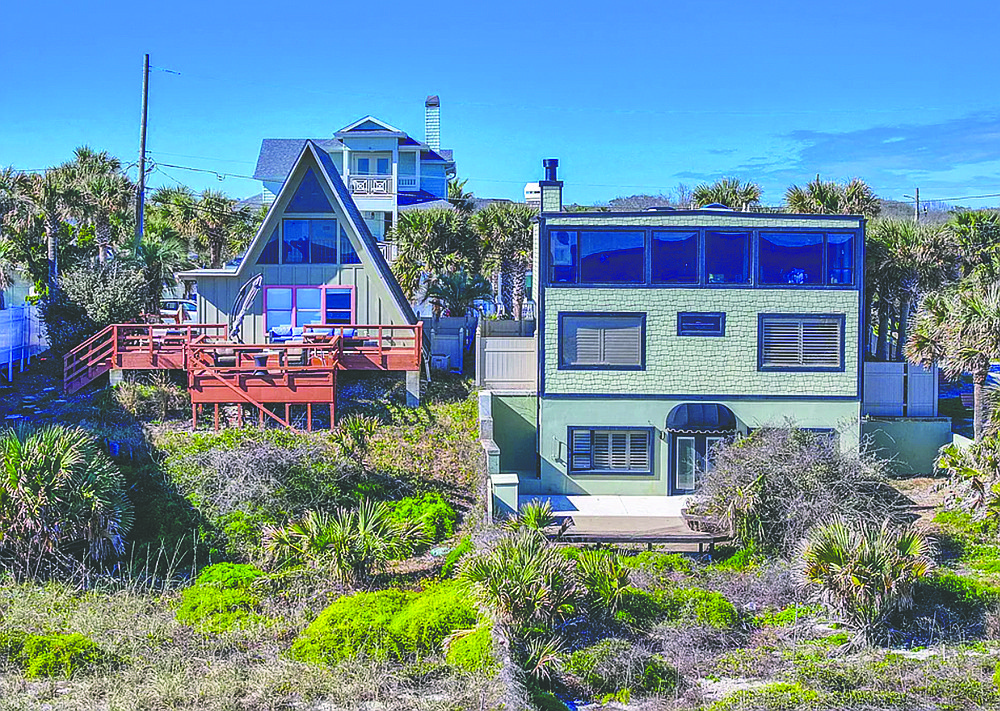 Two oceanfront residences, featuring five bedrooms, three full and one half-bathrooms, deck, patio and two-car garage.
