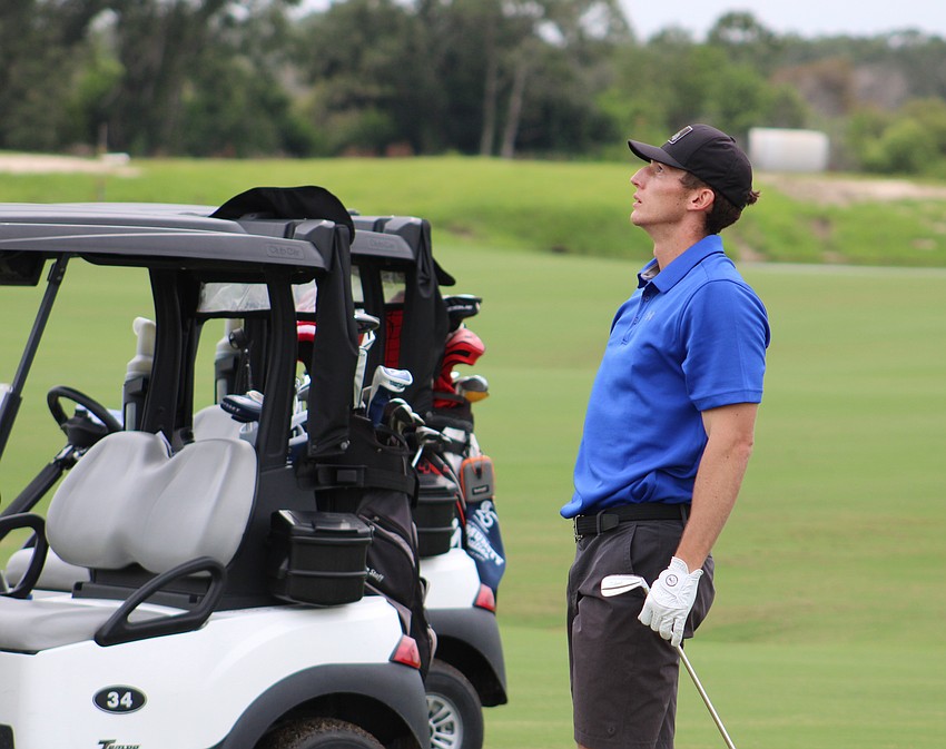 Matt Ambrosino, a golfer of five years, watches to see where his golf ball falls during the Communi-Tee Golf Classic at Calusa Country Club.