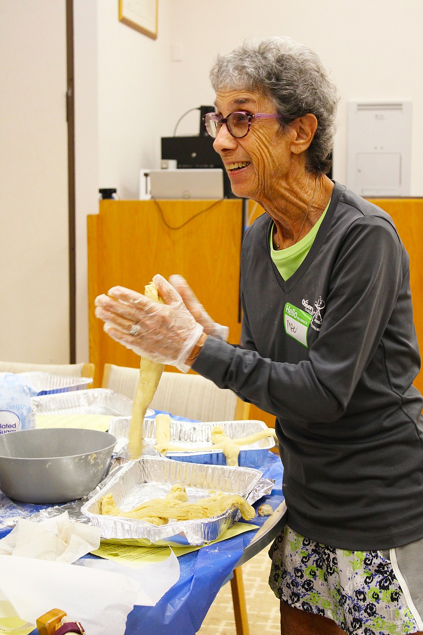 Maxine Spitzer rolls a challah braid at a Temple Beth Israel workshop on Sept. 18.