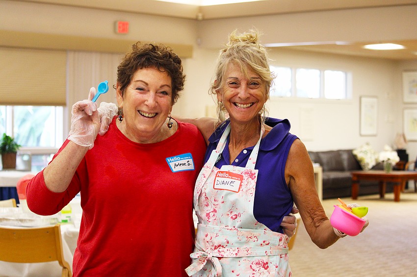 Arlene Skversky and Diane Weisman don't claim to be the most experienced bakers, but they were all smiles while learning how to bake challah on Sept. 18 at Temple Beth Israel.