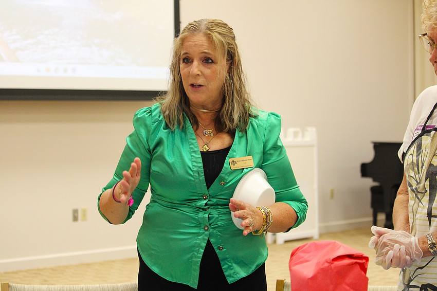 Rabbi Jessica Spitalnic Mates explains how to get a challah dough started to attendees at a Sept. 18 bread-making workshop at Temple Beth Israel.