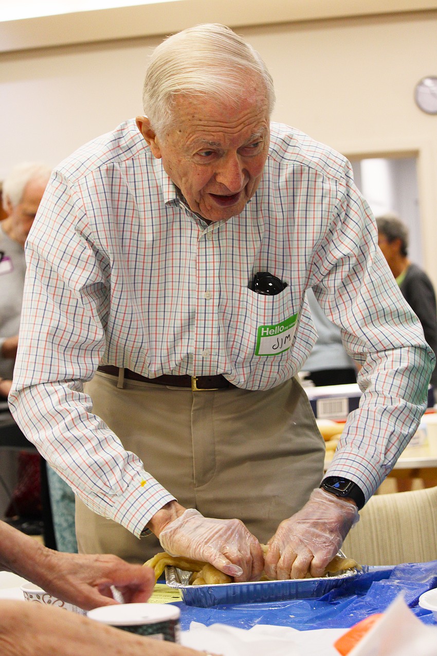 Jim Heskett, an accomplished baker in his own right, practices his challah braiding technique at a Sept. 18 workshop at Temple Beth Israel.