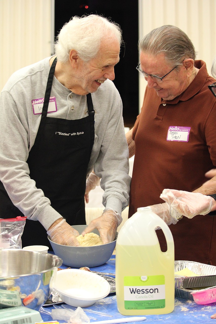Irwin Pastor and Rabbi Howard Simon share a laugh while they craft the self-proclaimed 