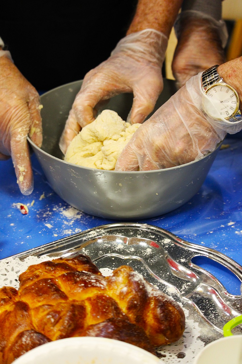 Flour went flying every which way as workshop attendees got involved with making their own challah, taking child-like glee in the hands-on activity.