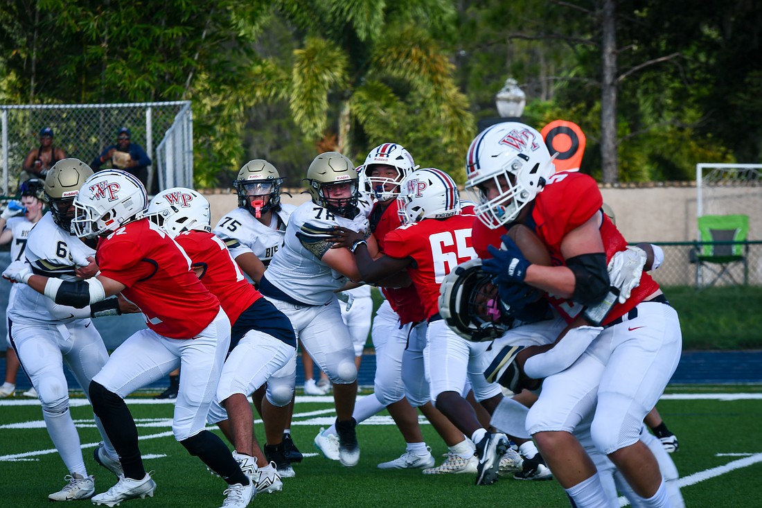 Windermere Prep rushed against Bishop McLaughlin Catholic.